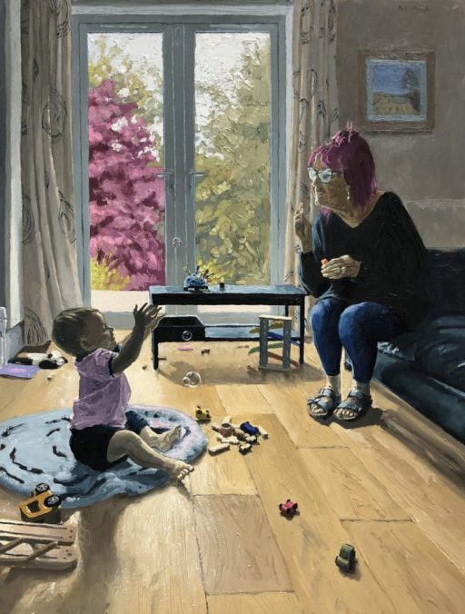 A grandma blows bubbles for her grandson